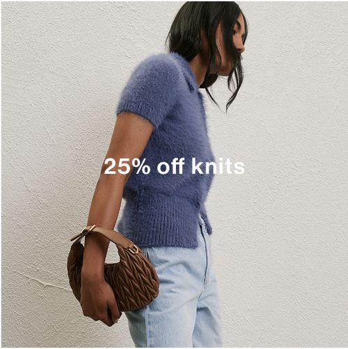 Woman posing in front of a white wall wearing a blue collared knit with text that states "25% off knits"