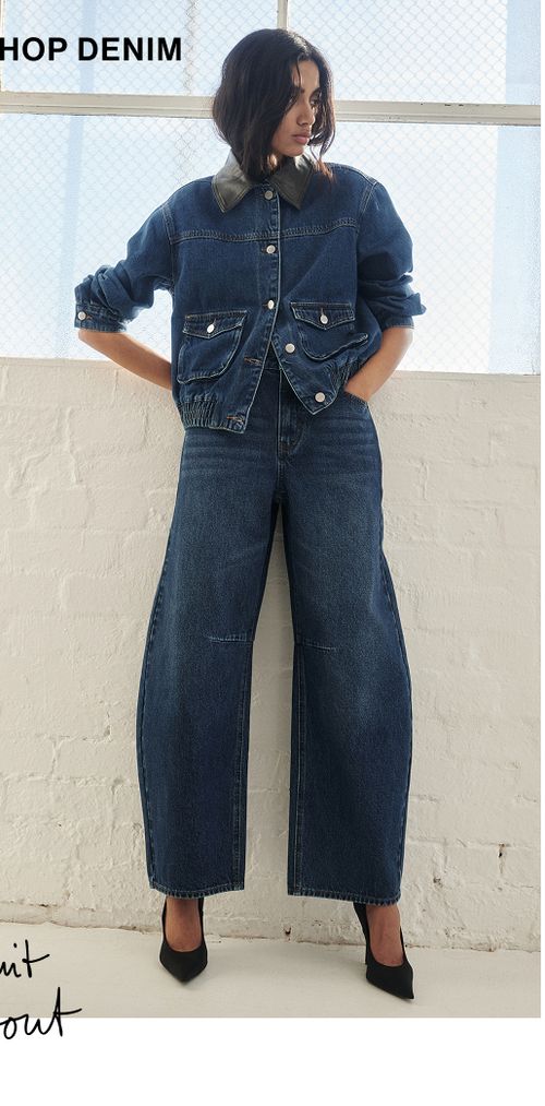 Woman posing in a matching denim set