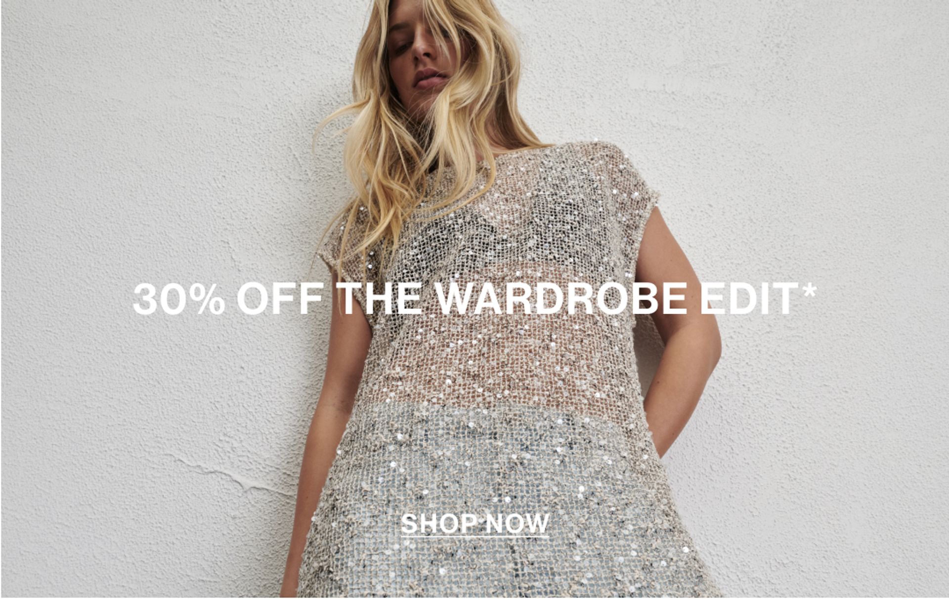Model wearing a white sequin dress with text overlay: "30% OFF THE WARDROBE EDIT"