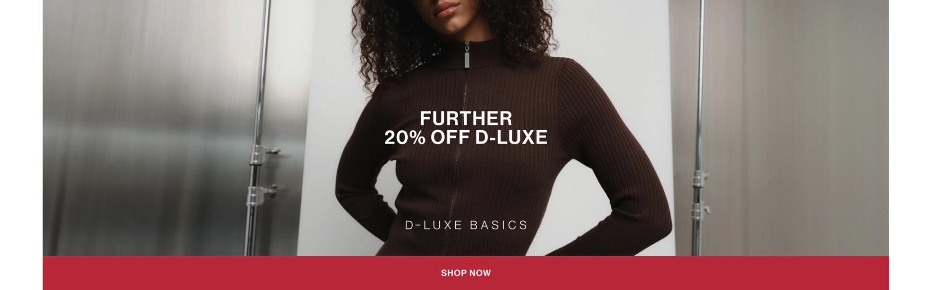 Model in a leather jacket standing in front of a white wall with text overlay which states "20% OFF DLUXE BASICS"