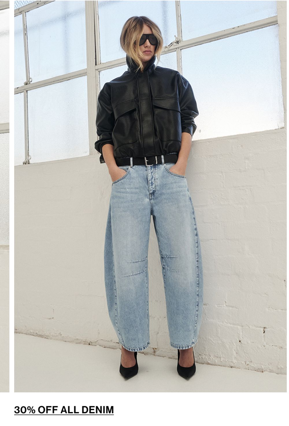 Woman posing in a matching denim set