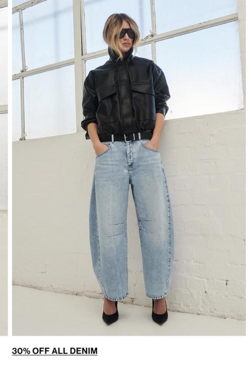 Woman posing in a matching denim set