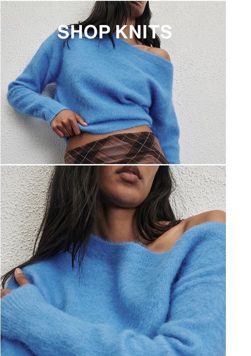Woman in a blue knit in front of a white wall with text that reads "20% off all Knits"