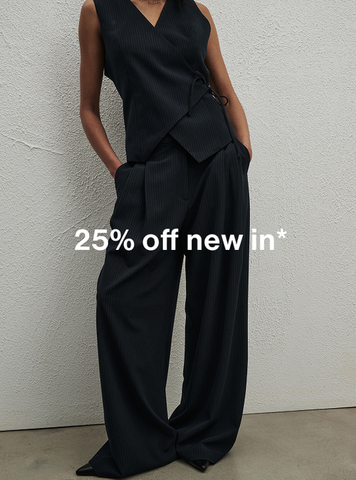Model in a blue pinstripe coordinated set, standing casually. Text reads ‘25% off new in'