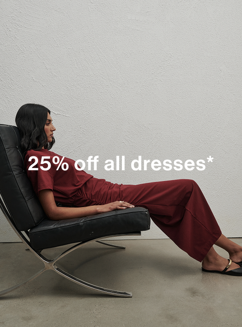 Model in a red dress, sitting on couch. Text reads ‘25% off all dresses'