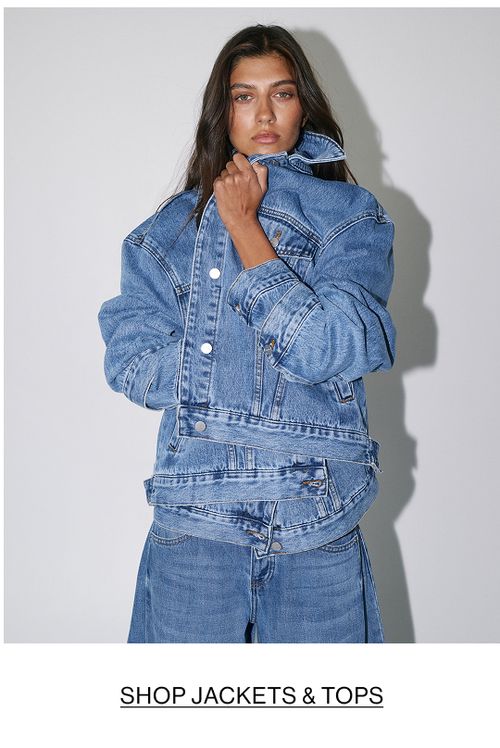 Woman in double chocolate denim with text that states "SHOP JACKETS & SHIRTS"