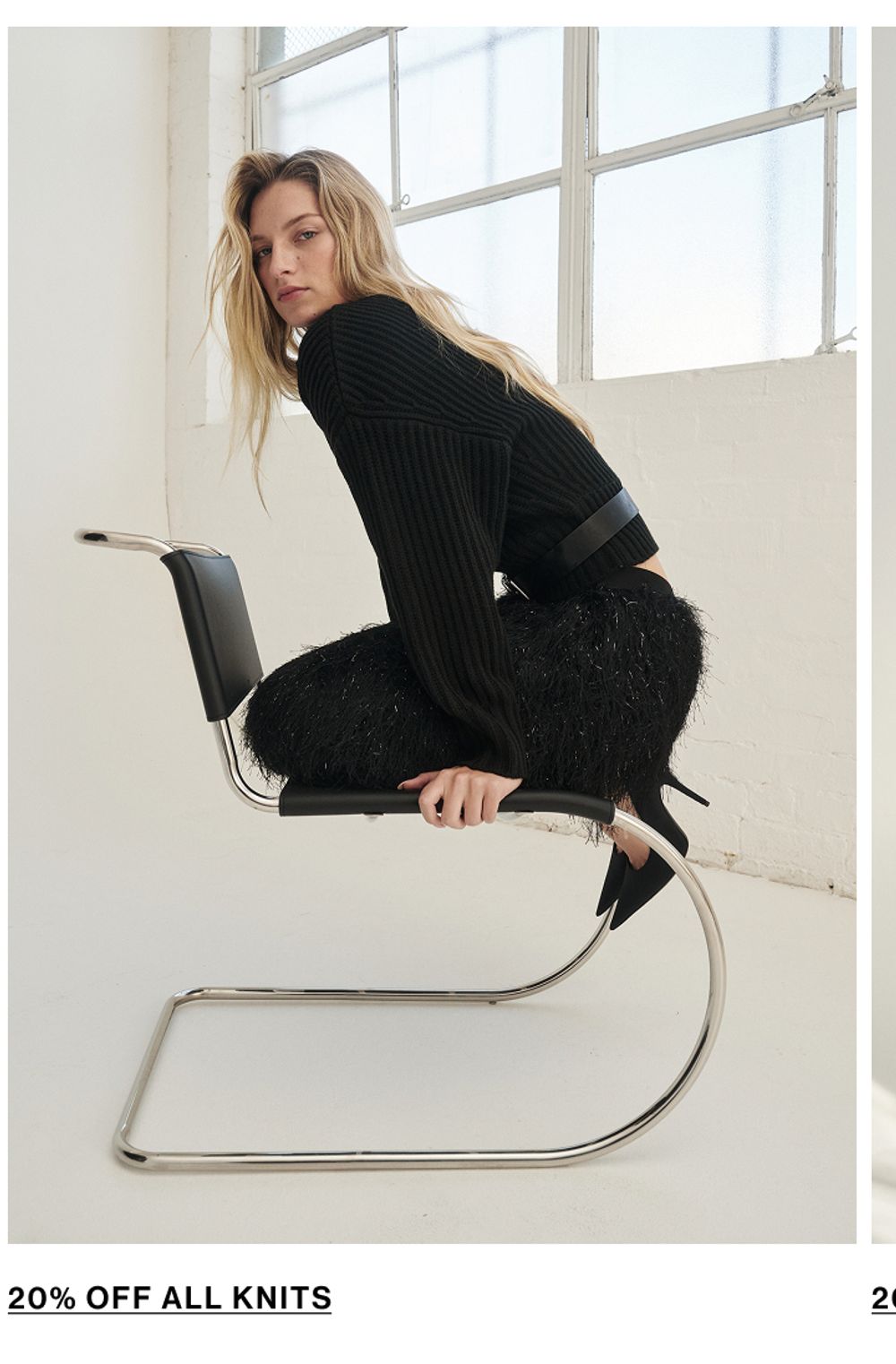 Woman posing in a black knit