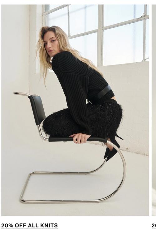 Woman posing in a black knit