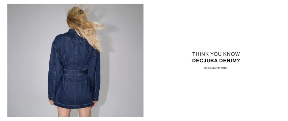 Model seen from behind wearing a dark indigo denim mini dress with long sleeves and a cinched waist, set against a neutral background beside the text “Think you know Decjuba Denim?”