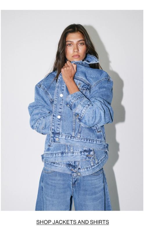Woman posing in a denim jacket with text overlay Shop jackets and shirts