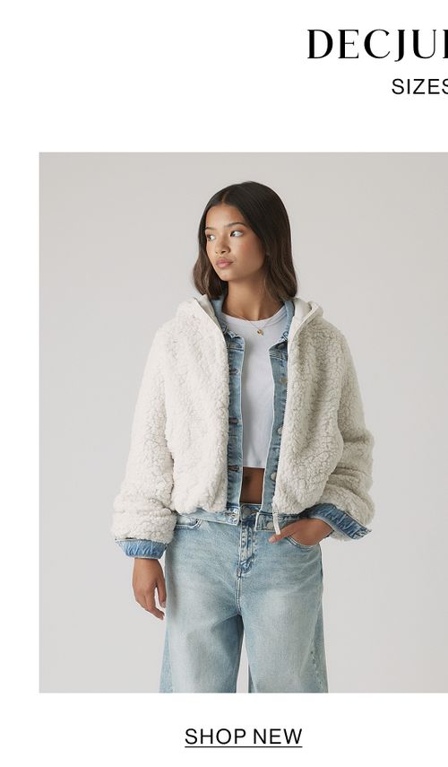 Girl wearing a cream shearling jacket and jeans – Kids New In.