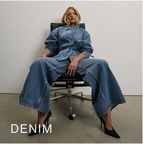 Model wearing a light denim jacket and jeans. SHOP DENIM.