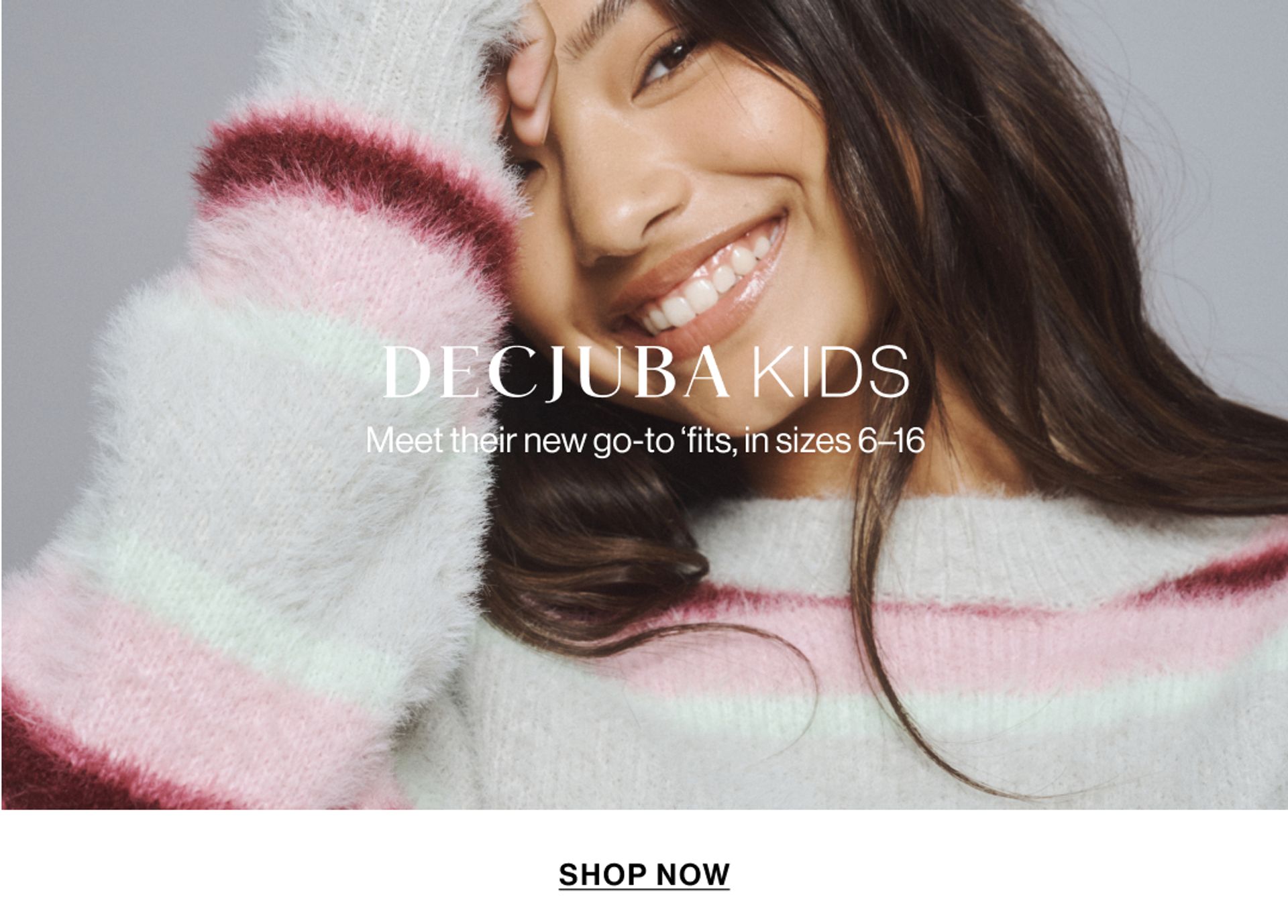 Model wearing a stripe knit in a studio. Text reads SHOP DECJUBA KIDS