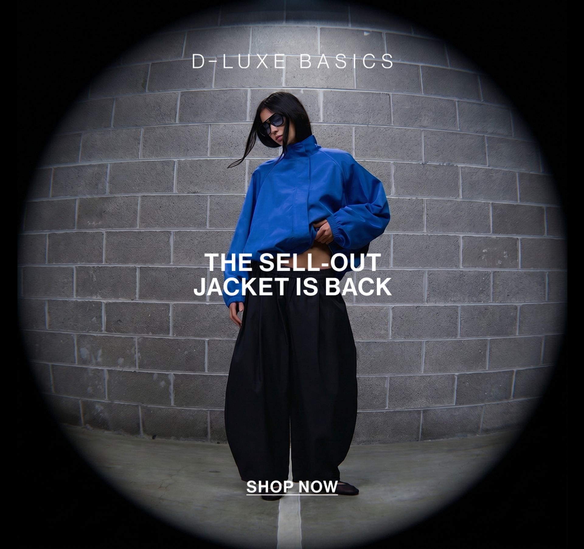 Images of model wearing new D-LUXE jacket in cobalt blue