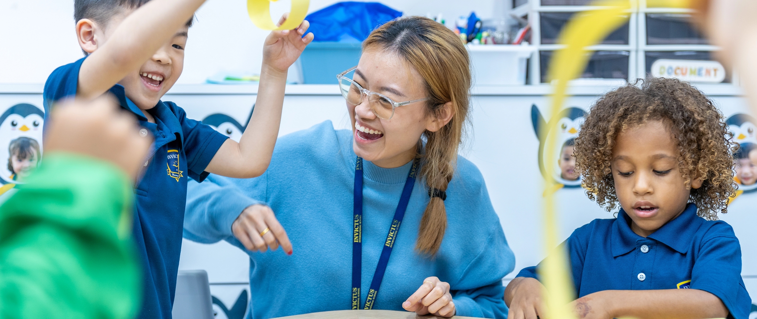 2 Invictus Students laughing and interacting with Teacher