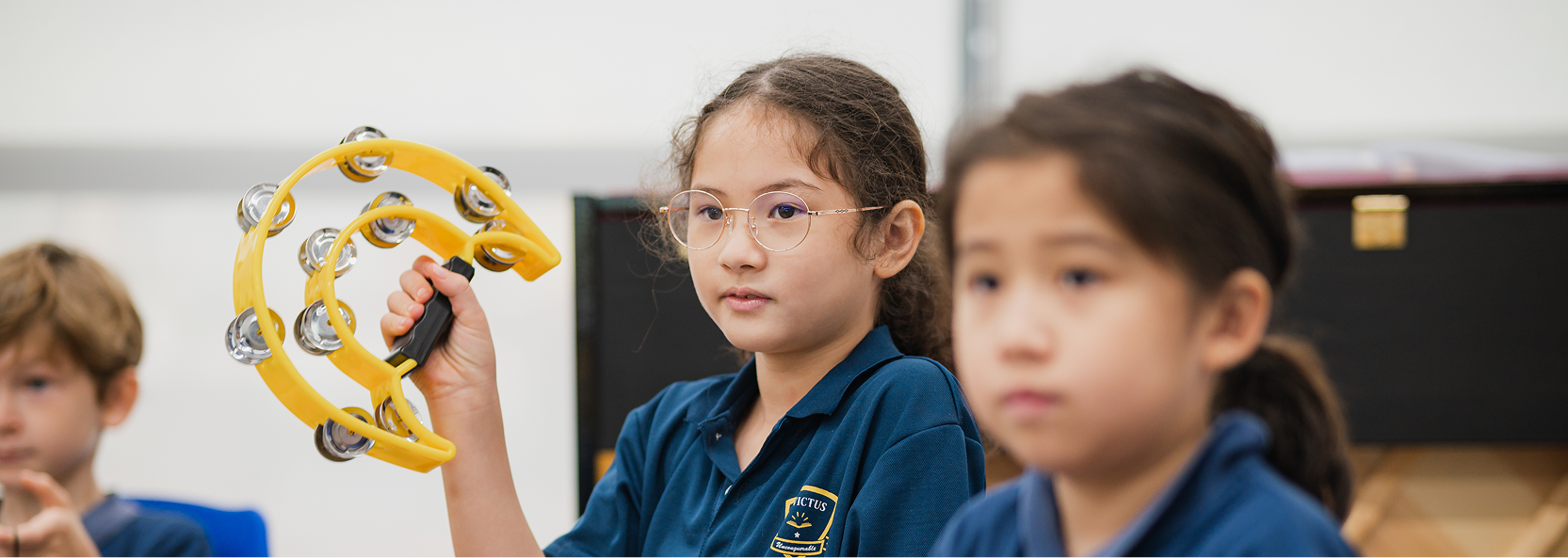 Primary Students playing tamborine