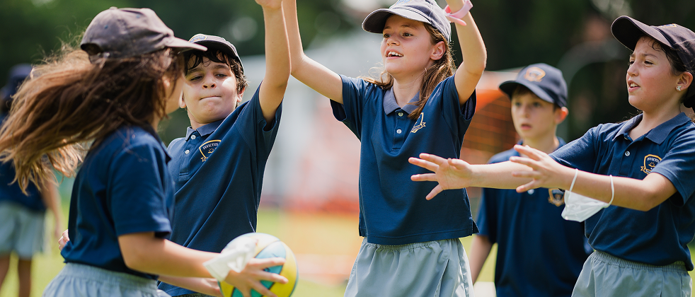 Invictus students participating in a team sports activity during PE class.