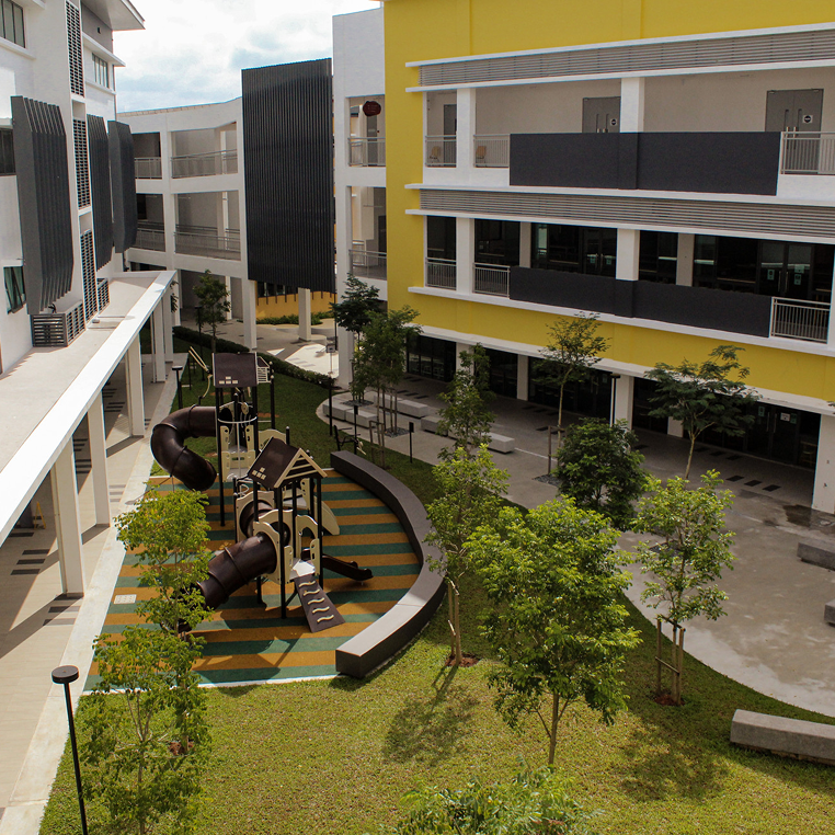 Outdoor playground nestled within the interior of school campus of Horizon Hills Invictus International School Malaysia, designed for student recreation.