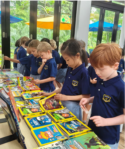 Students exploring a wide range of colourful books during a book fair, encouraging a love for reading and literacy.