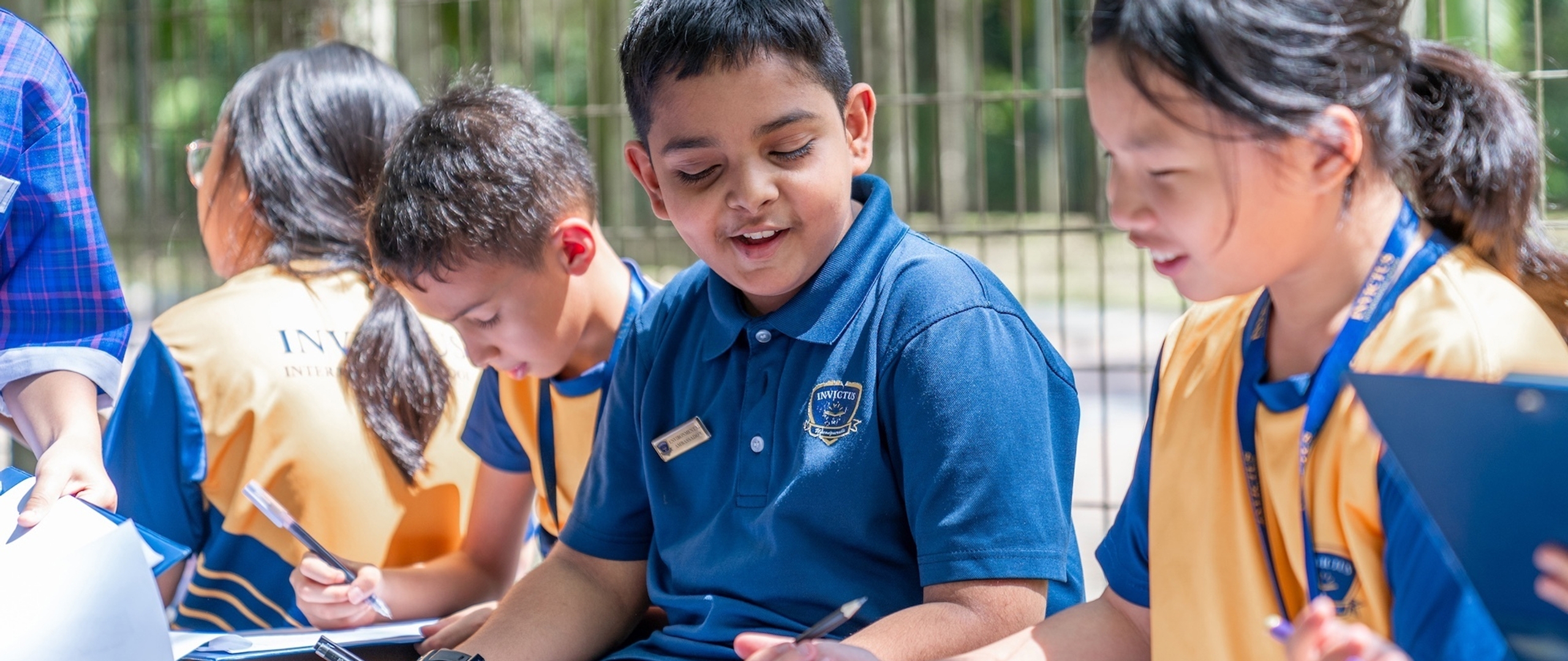A group of students learning outdoors