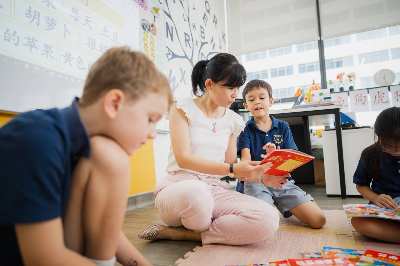 teacher helping students