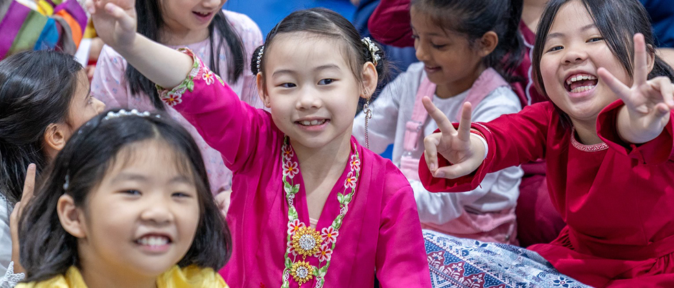 Invictus students wearing multinational traditional clothing