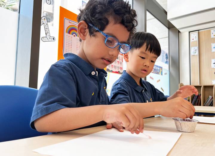 Two students having fun in art class