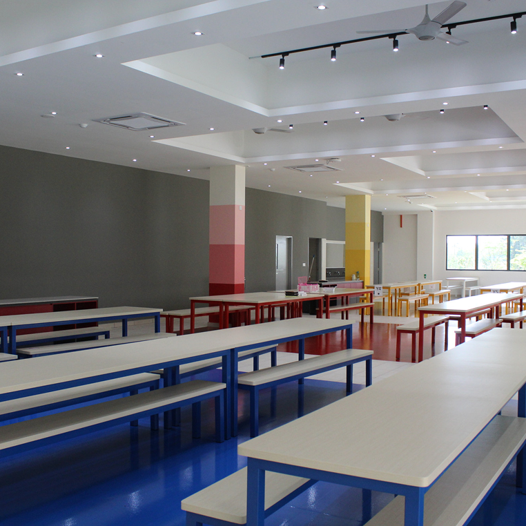 Bright and colourful cafeteria at Horizon Hills Invictus International School Malaysia with modern seating for students.