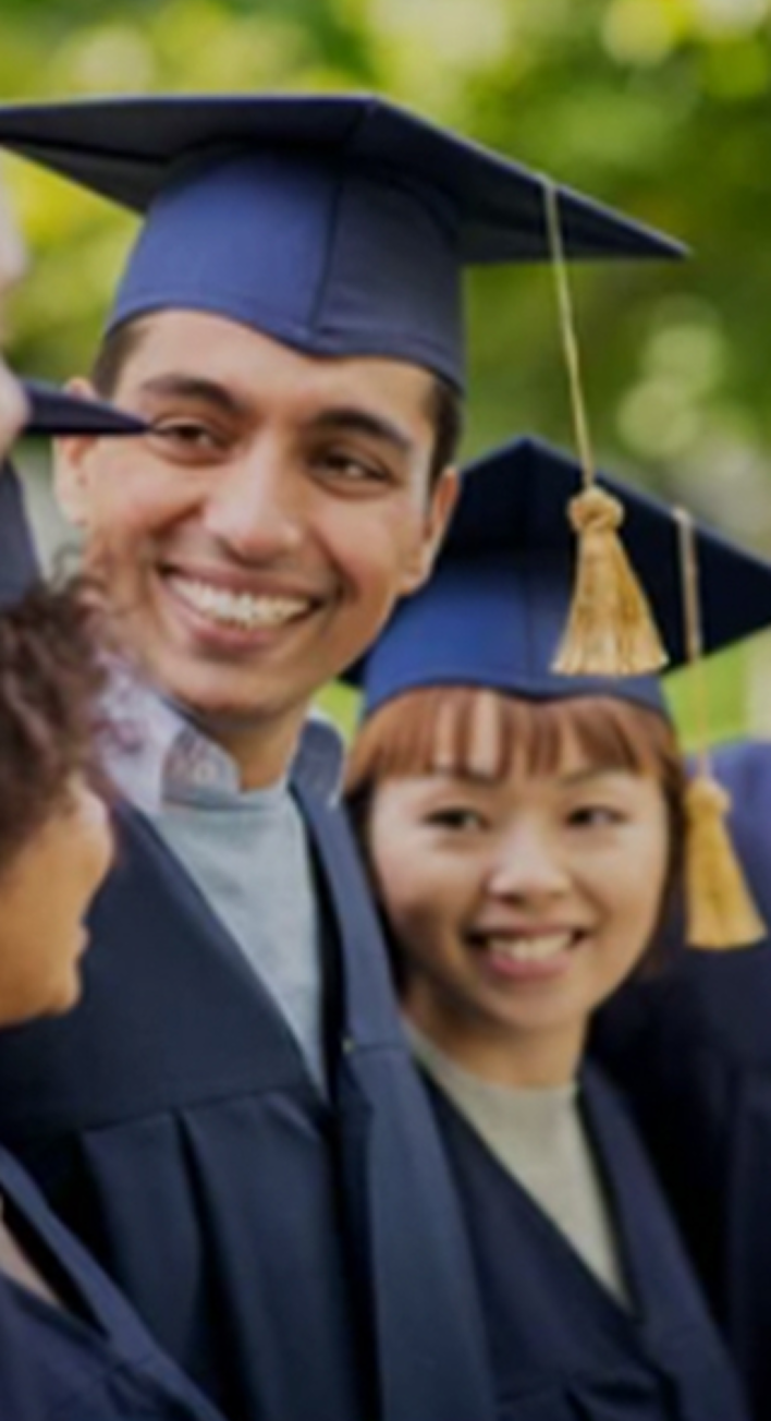 3 Invictus graduates wearing toga and graduate gap