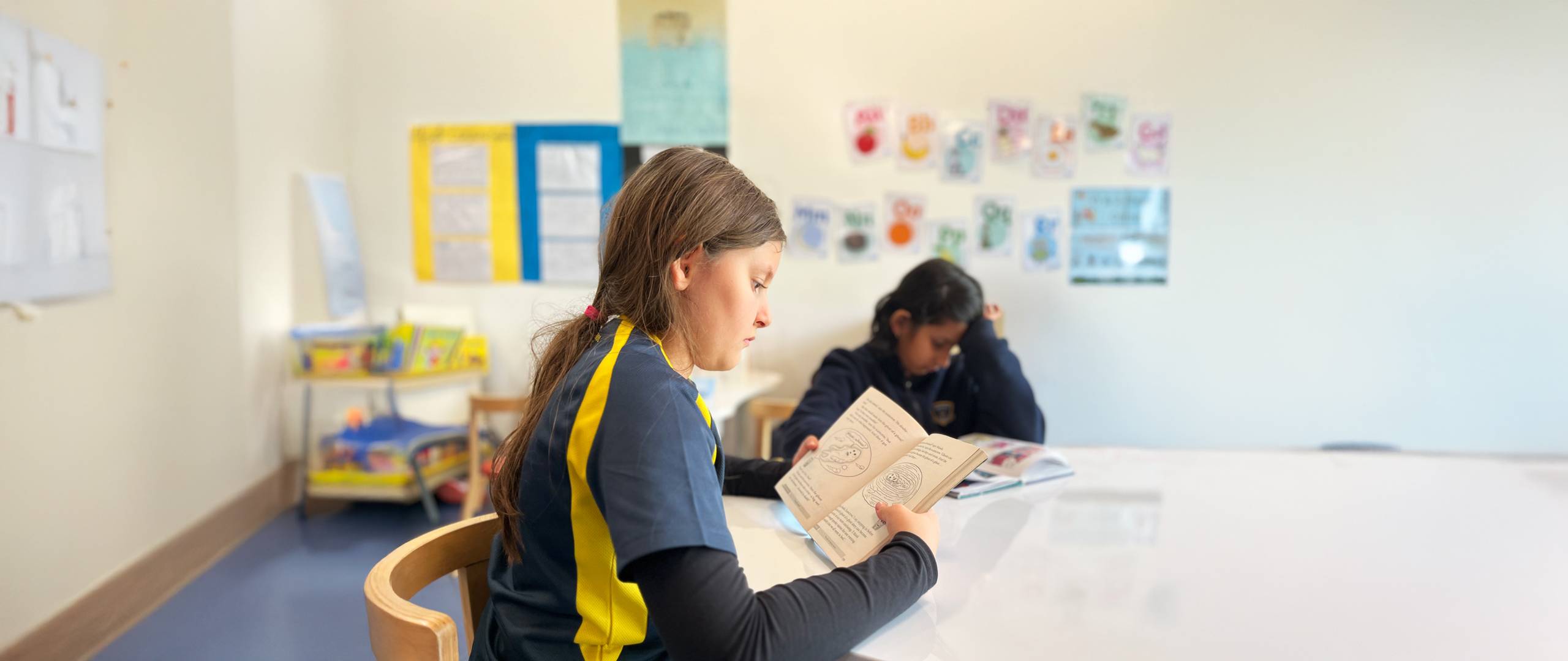 The young student reading in class
