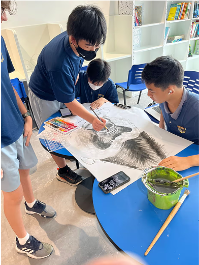 Secondary students collaborating on an expressive art project, developing creativity and teamwork during an art lesson.