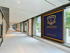 Invictus TseungKwan O corridor with large logo banner