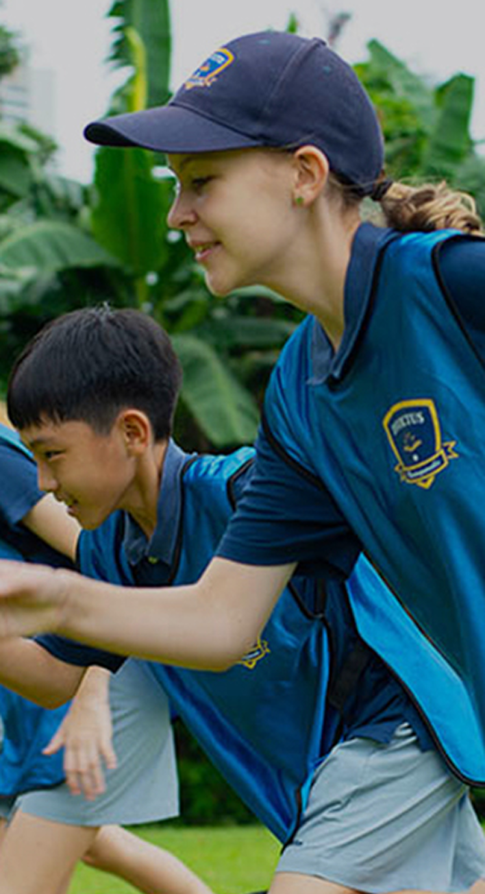 Invictus student wearing Invictus uniform and sports cap, ready to run in a field