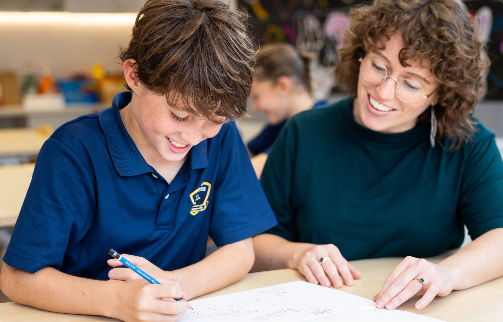 Teacher and student studying together