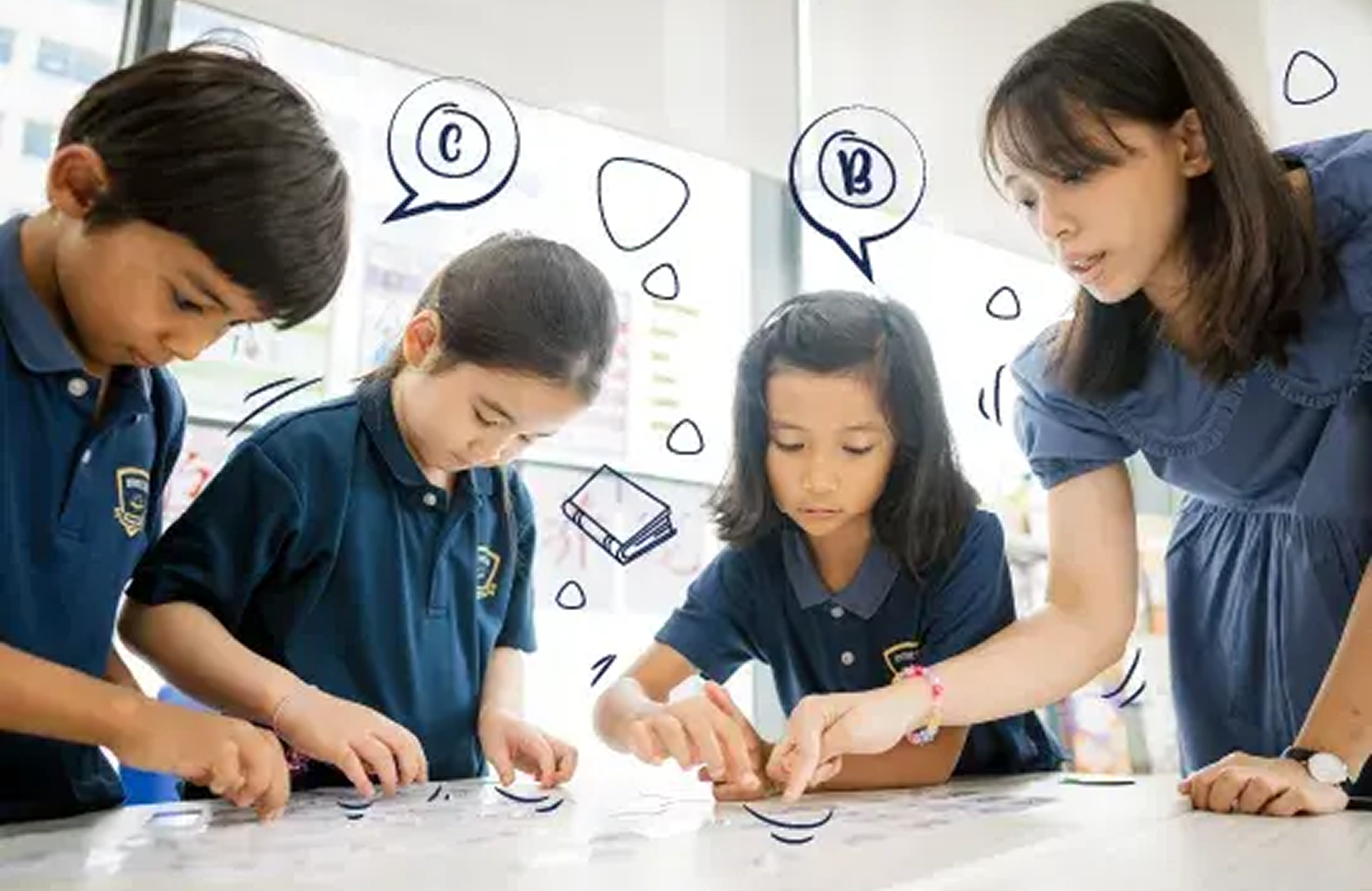 A teacher guides a small group of young learners through an interactive learning task, promoting teamwork and problem-solving at Invictus International School.
