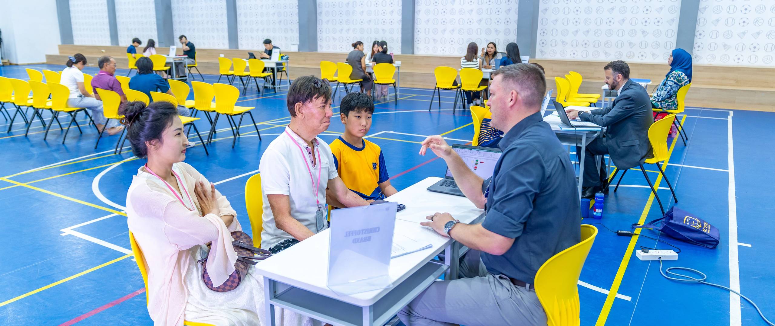 Students at Invictus Horizon Hills Malaysia enjoying outdoor activities with teachers, reflecting the joyful and diverse spirit of the campus.