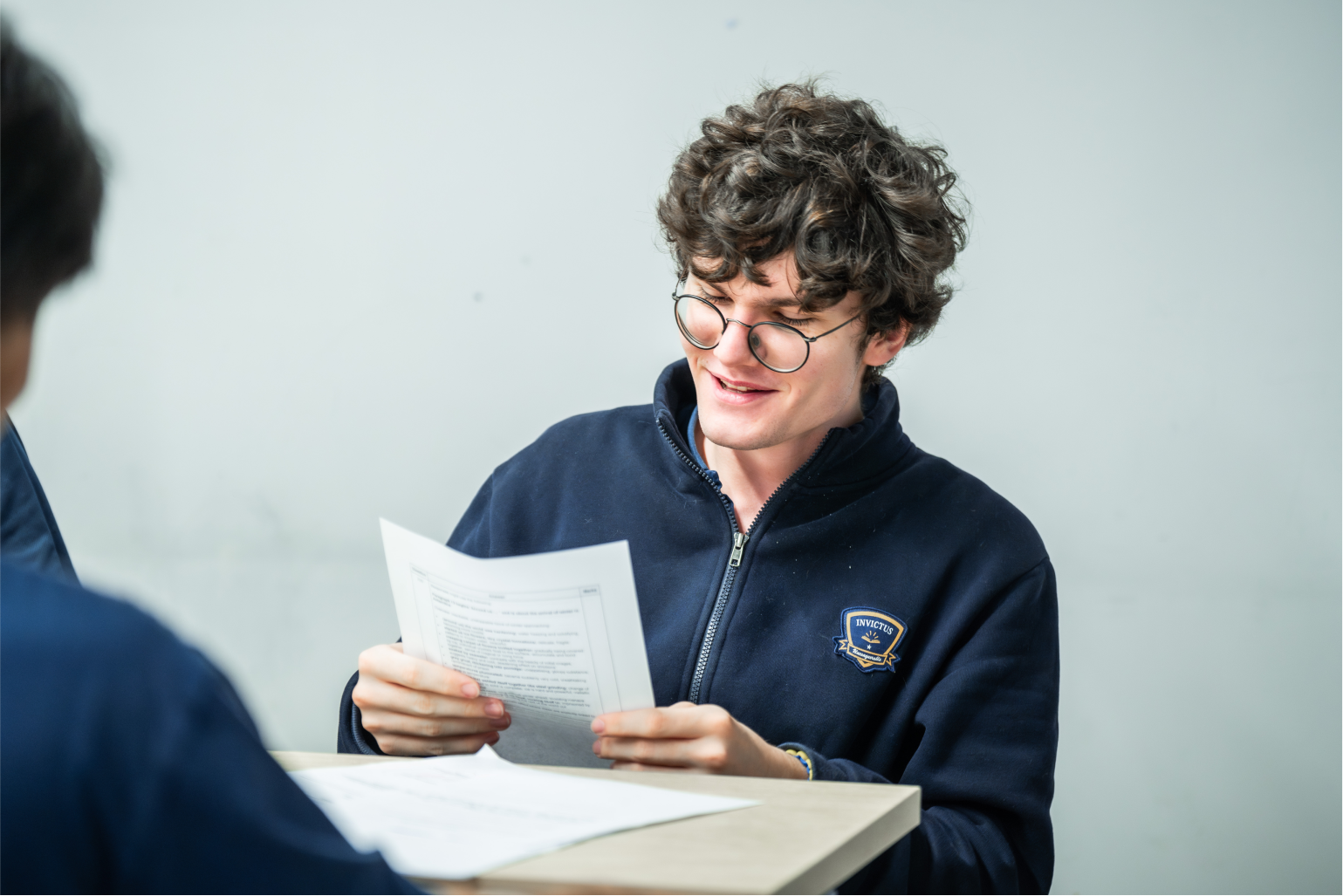 Teacher and student reviewing work together