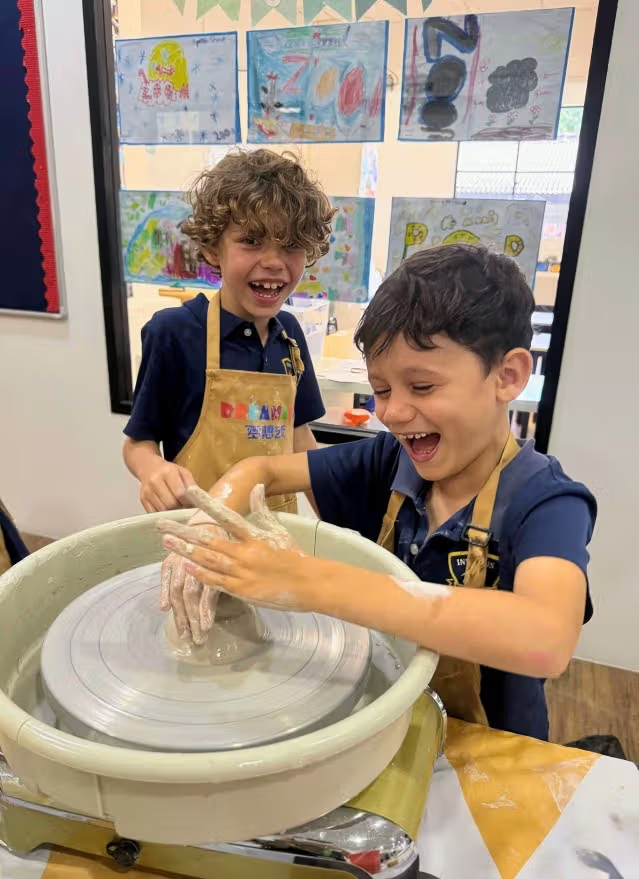 Pottery Class getting hands on clay throwing on turn table