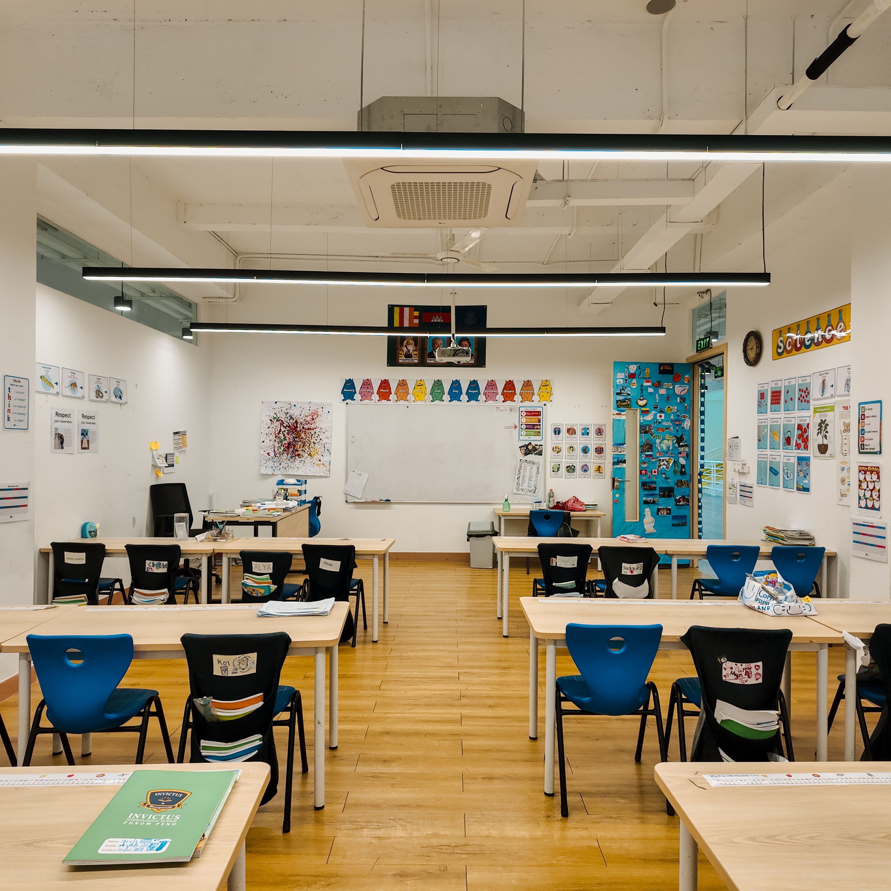 Close-up view of a blue triangular rope climbing structure at Invictus Phnom Penh, encouraging physical development and coordination in a safe play space.