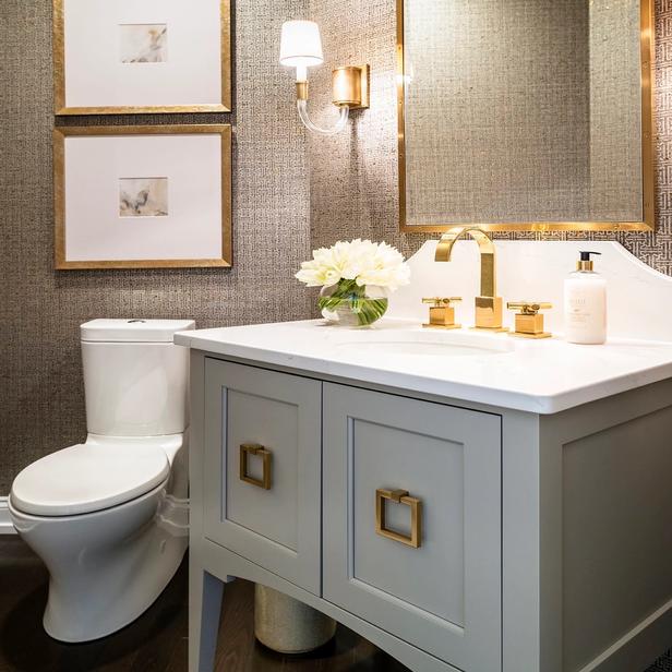 A corner bathroom with a white vanity.
