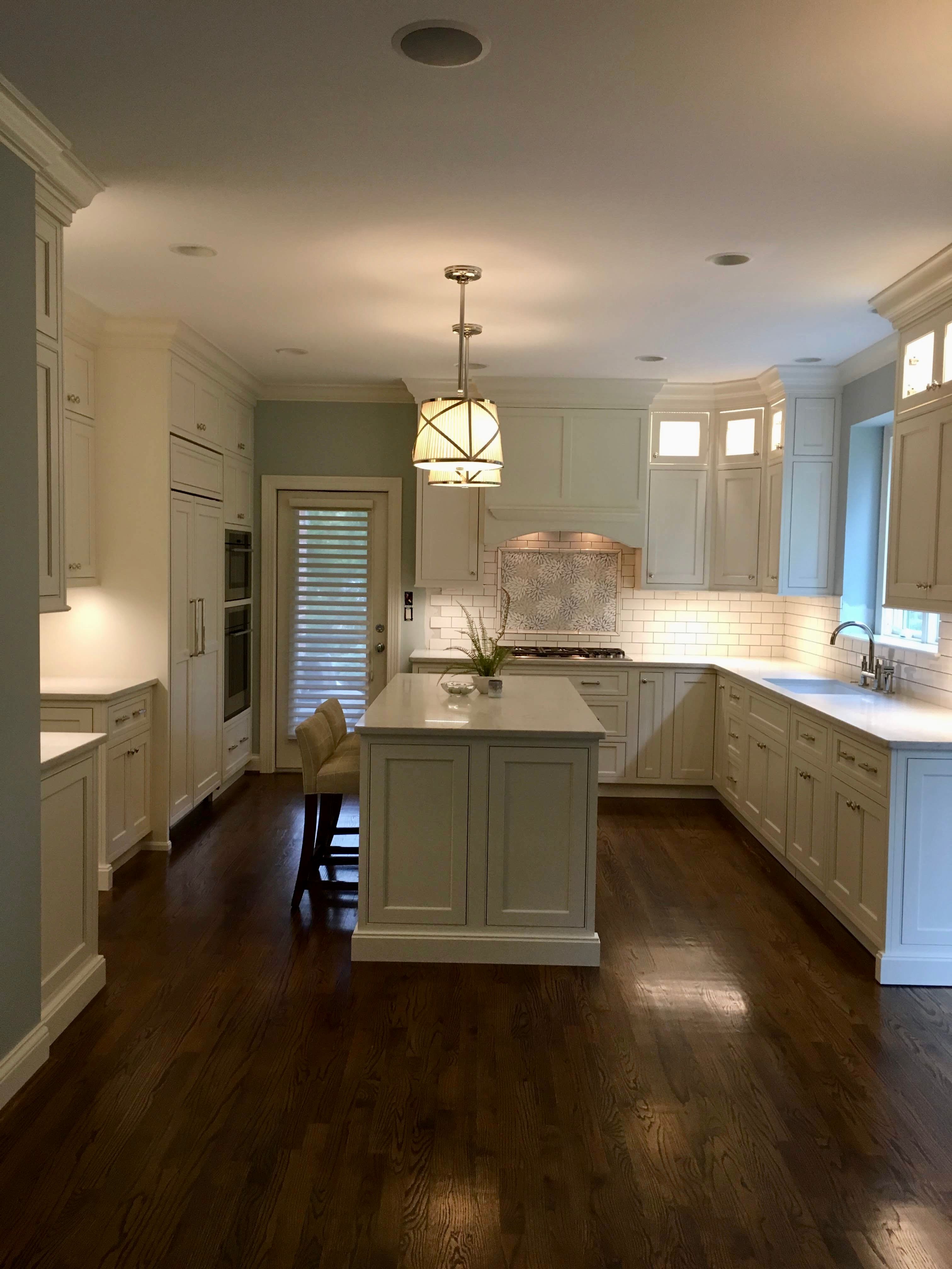 White kitchen with island by Dana Snyder