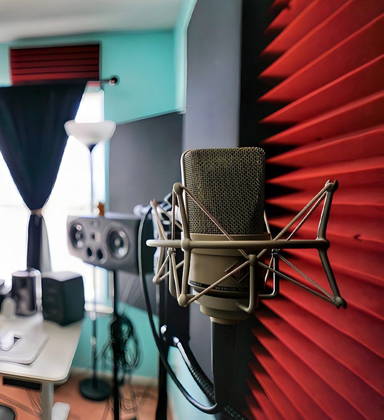 Acoustic treatment on a wall with a mounted microphone for vocal recordings