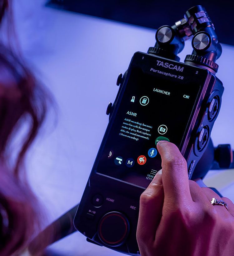Close up of girl's hand using Tascam Portacapture