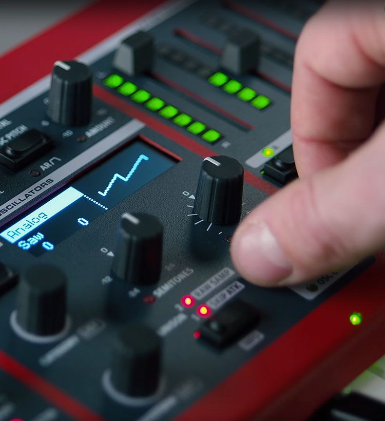 Close up of guy's hand using Nord synth