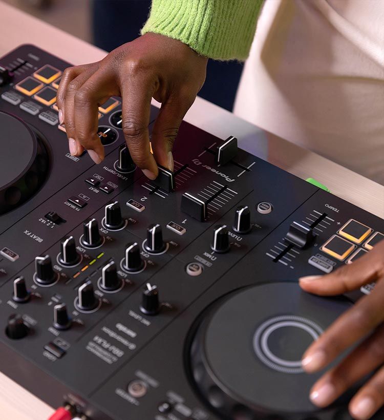 Close up of girl's hands playing Pioneer DJ dj controller