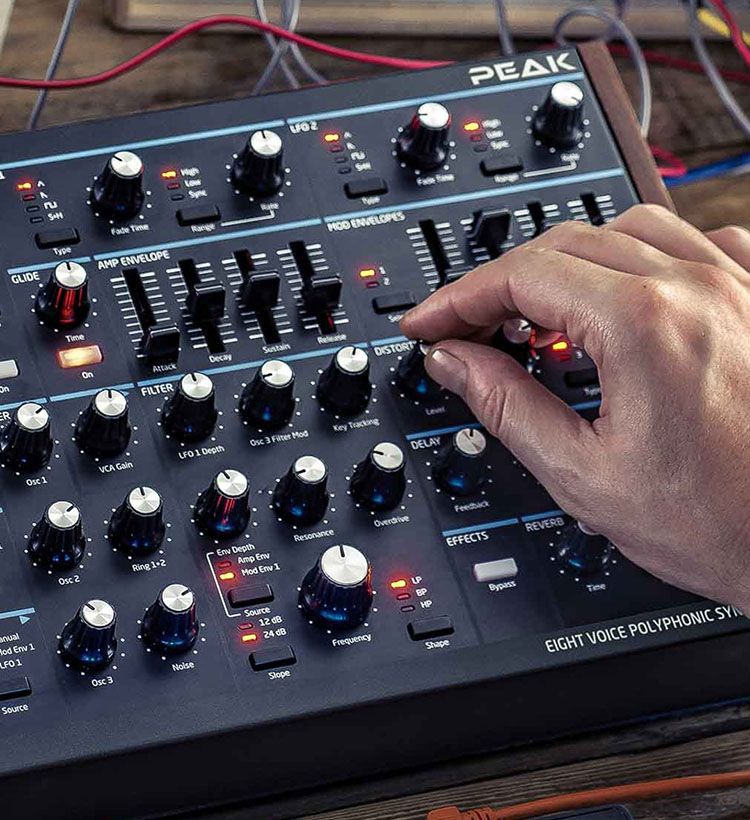 Close up of guy's hand using Novation synth