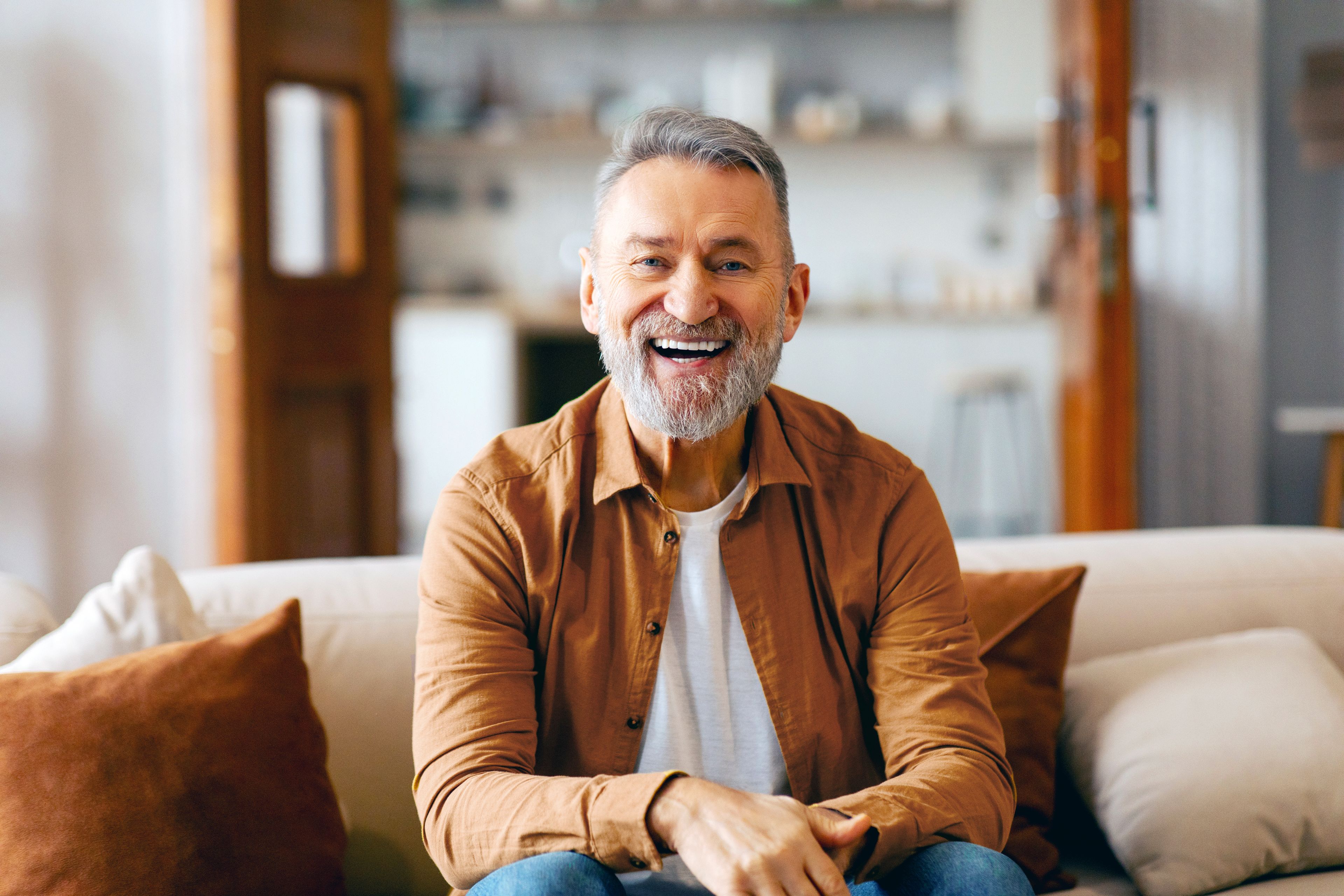 Happy dental implant patient in the UK after finding an affordable implant provider