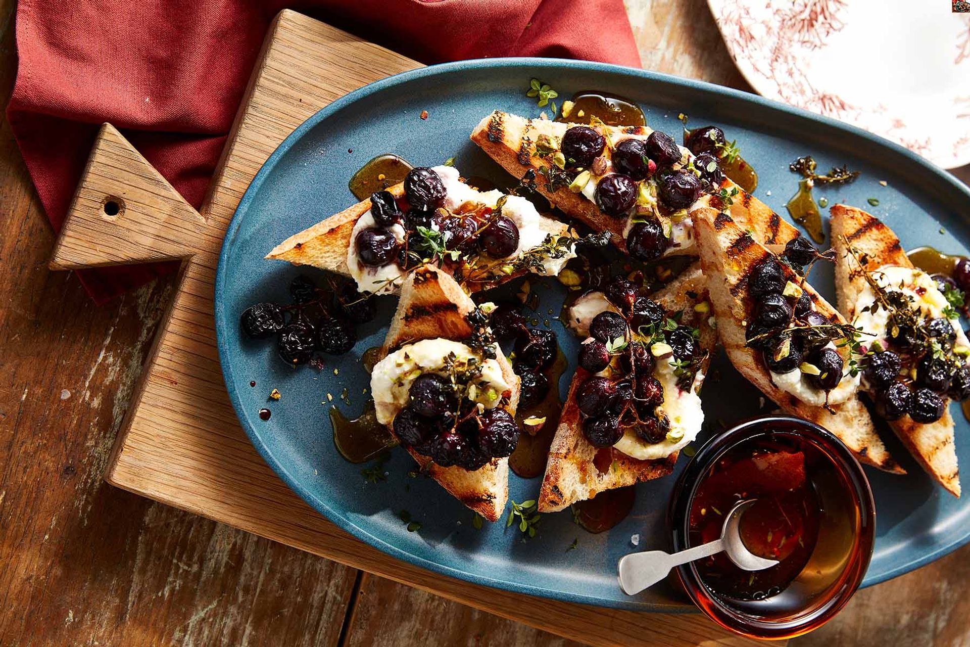 Whipped ricotta and honey-roasted grape crostini