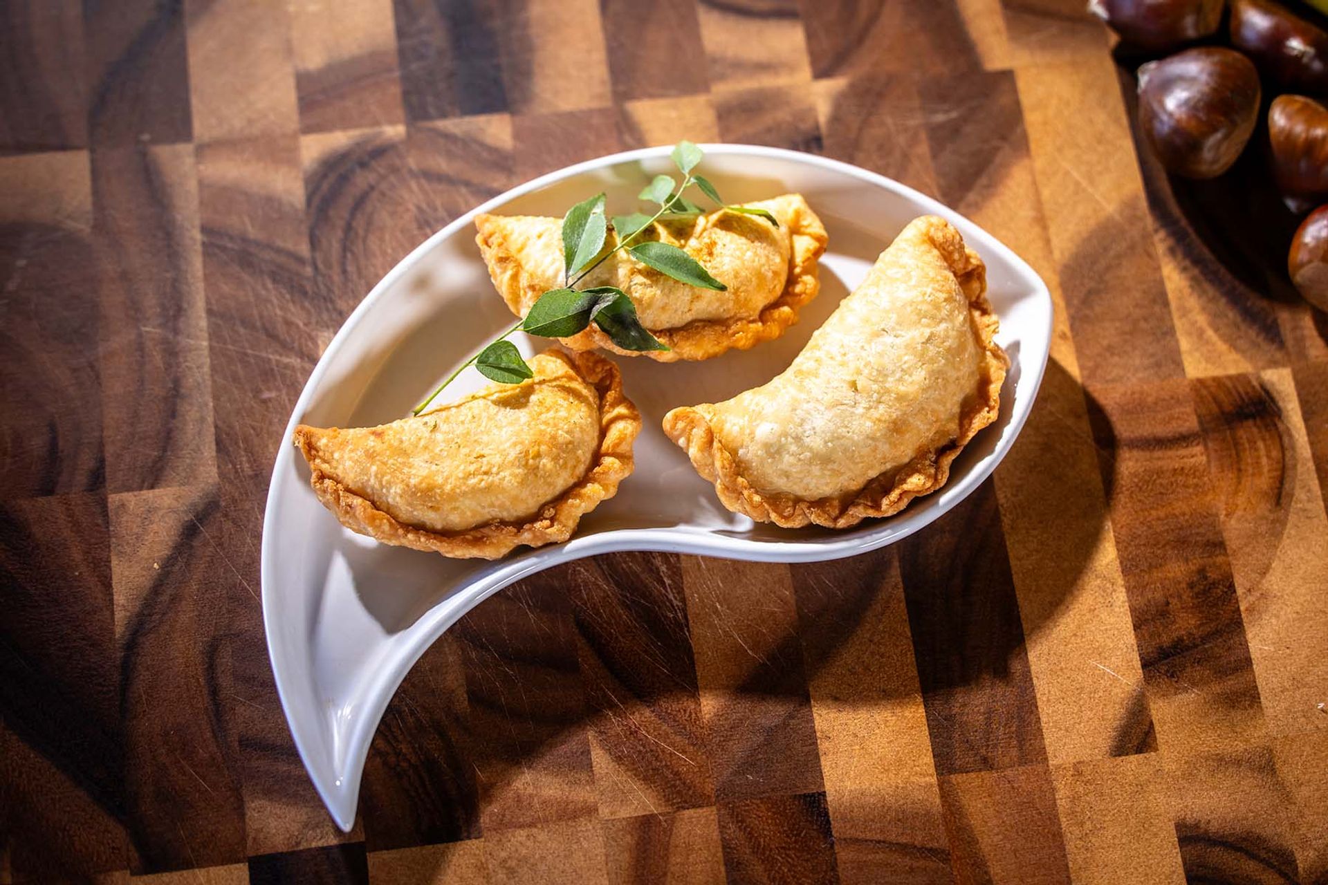 Curry puffs on a platter