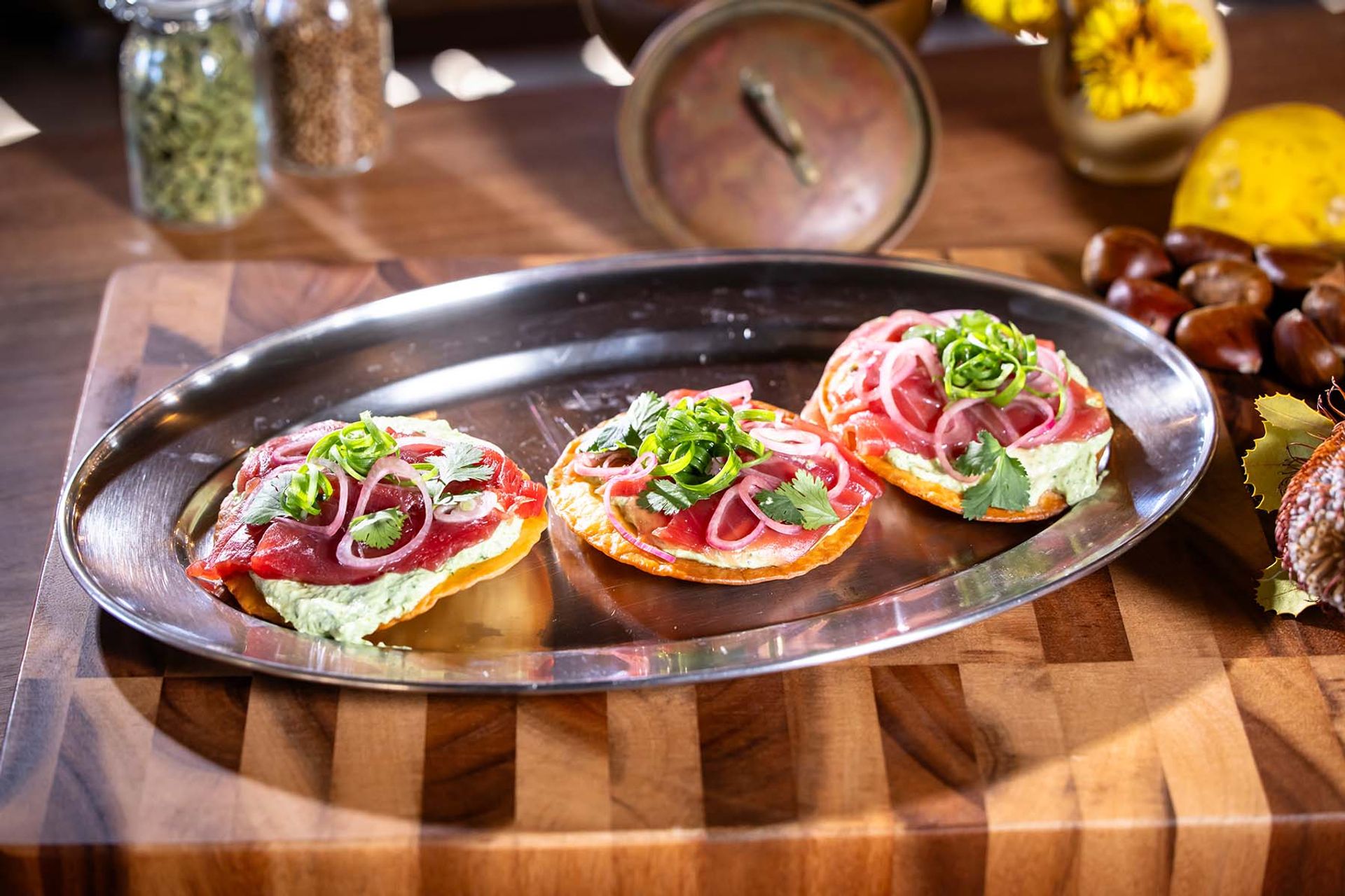 Tuna tostada with avocado crema